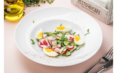 Young radish salad with egg and sour cream
